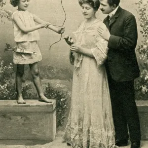 Couple pose by cupid ?statue? Couple pose by cupid ?statue?