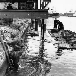 Dockside scene with men on a raft, London Dockside scene with men on a raft, London