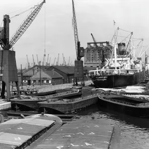 Dockside scene with vessels and cranes, London Dockside scene with vessels and cranes, London
