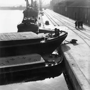 Dockside scene with vessels and cranes, London Dockside scene with vessels and cranes, London