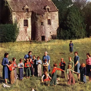 Evacuees in the grounds of their Hostel Evacuees in the grounds of their Hostel