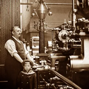 Factory or mill steam engine driver and his son