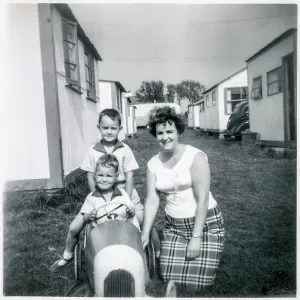 Family pose for the camera at a British holiday camp Family pose for the camera at a British holiday camp