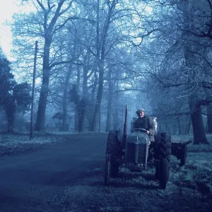 Farmer on tractor on a frosty morning Farmer on tractor on a frosty morning