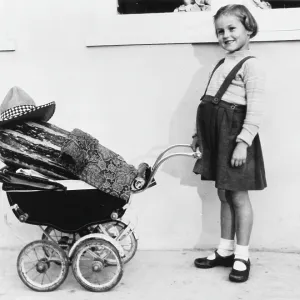 GIRL WITH MARROW IN PRAM GIRL WITH MARROW IN PRAM