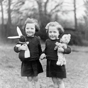 Two girls playing with their toys Two girls playing with their toys
