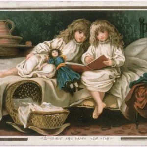 Two girls read a storybook
