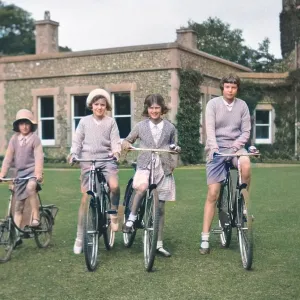 Four girls riding bicycles Four girls riding bicycles