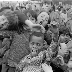 Group of children cheering to camera at fete Group of children cheering to camera at fete