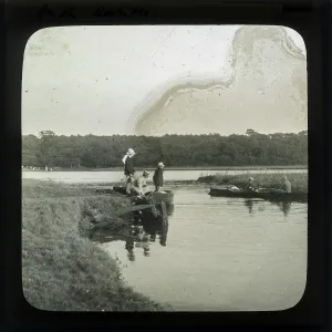 Group of men boating on a lake Group of men boating on a lake