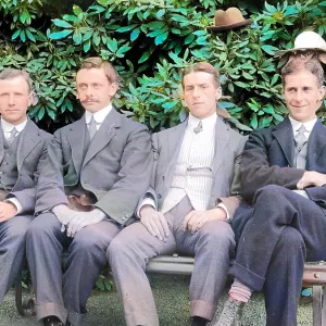 Group of four men with hats