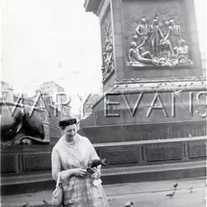 LADY FEEDS PIGEONS LADY FEEDS PIGEONS