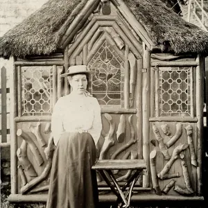 Lady outside a rustic summer house