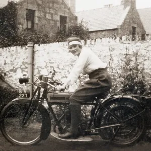 Lady sitting on 1918 Triumph motorcycle Lady sitting on 1918 Triumph motorcycle