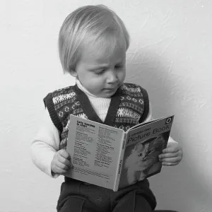Little boy reading a picture book Little boy reading a picture book