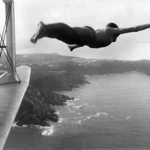 Man appearing to dive into the sea from an aeroplane Man appearing to dive into the sea from an aeroplane