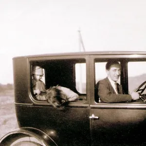 Man and two children in a car Man and two children in a car