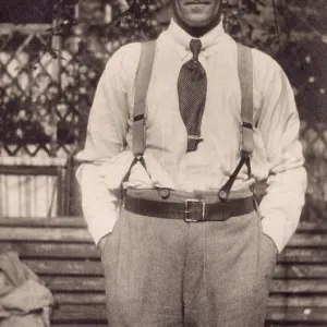 Man in garden in shirtsleeves Man in garden in shirtsleeves