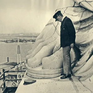 Man Standing by Big Toe of Copper Foot of the Man Standing by Big Toe of Copper Foot of the