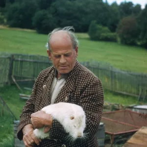 Man with white coypu Man with white coypu