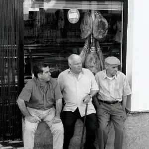 Three men outside shop, Spain Three men outside shop, Spain