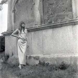 Model posing in a graveyard Model posing in a graveyard