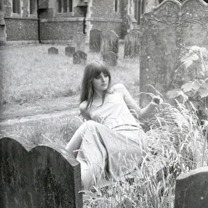 Model posing in a graveyard Model posing in a graveyard