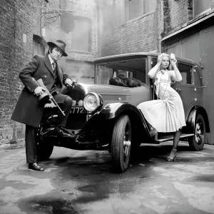 Models pose for a Bonnie & Clyde style shoot Models pose for a Bonnie & Clyde style shoot