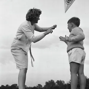 Mother and son flying their kite Mother and son flying their kite