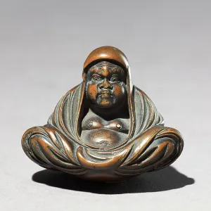Netsuke in the form of Daruma meditating Netsuke in the form of Daruma meditating