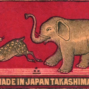 Old Japanese Matchbox label with an elephant chasing a deer Old Japanese Matchbox label with an elephant chasing a deer