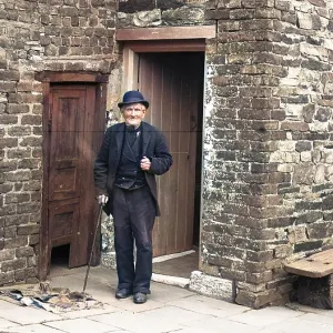 Old man outside house