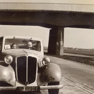 Two people in a car on the Autobahn, Germany Two people in a car on the Autobahn, Germany