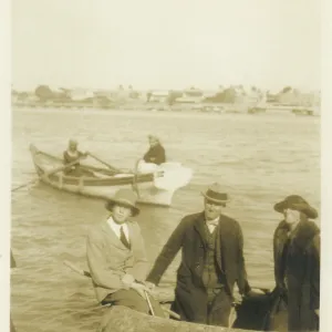 Three people in inflatable boat, Middle East Three people in inflatable boat, Middle East