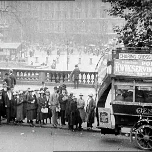People Queueing For A Bus In Trafalgar Square People Queueing For A Bus In Trafalgar Square