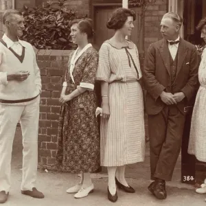 Five people standing outside a house Five people standing outside a house