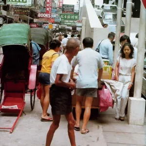 People walking in different directions on crowded street, Ho People walking in different directions on crowded street, Ho