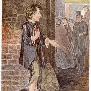 Poor boy, shoeless and in rags, begging on a street Poor boy, shoeless and in rags, begging on a street