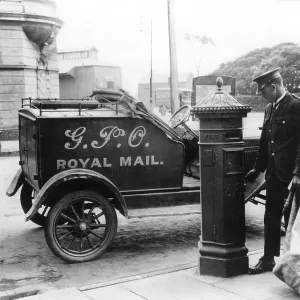 Postman parked next to postbox Postman parked next to postbox