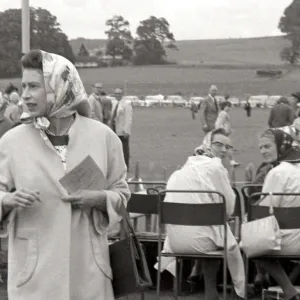 Queen Elizabeth II in headscarf at Cowdray Park