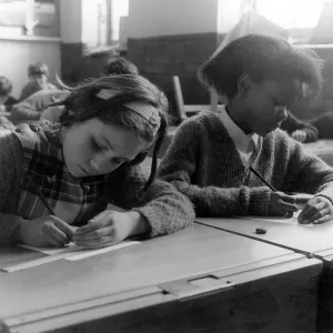 TWO SCHOOLGIRLS IN CLASS TWO SCHOOLGIRLS IN CLASS