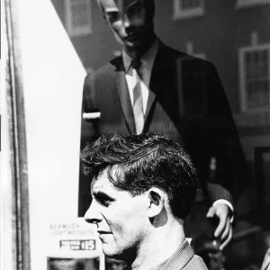 Shop window dummy looking at man in street Shop window dummy looking at man in street
