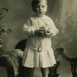 Small boy standing on chaise-longue Small boy standing on chaise-longue