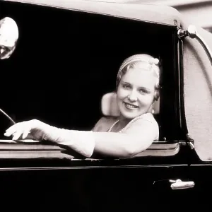 Smiling Blonde Woman Looking at Camera Out of Smiling Blonde Woman Looking at Camera Out of