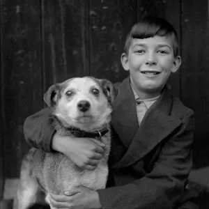 A smiling boy and his terrier dog A smiling boy and his terrier dog