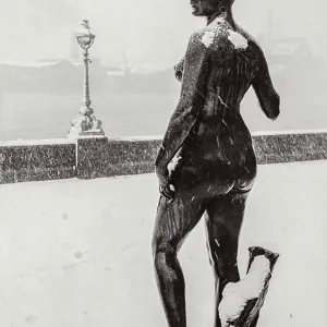 Stone statue, nude, in snow London Stone statue, nude, in snow London