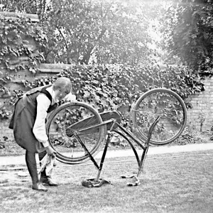 Student cleaning bicycle
