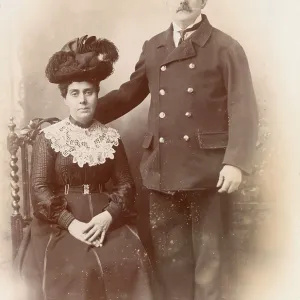 Studio portrait, Customs officer in uniform and wife Studio portrait, Customs officer in uniform and wife