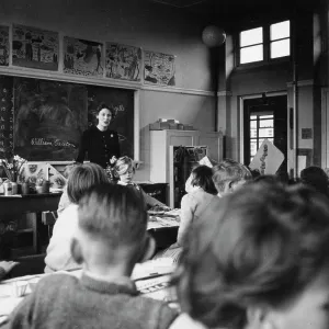 Teacher with class of primary school children Teacher with class of primary school children