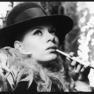 USING CIGARETTE HOLDER